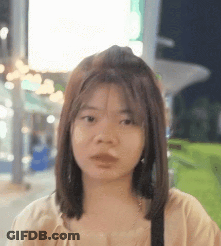 Woman With Short Hair Looking At Camera GIF