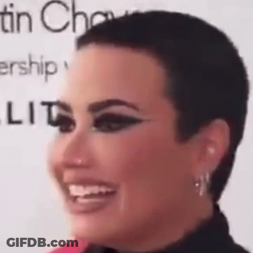 Woman With Short Haircut And Earrings GIF