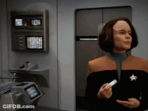 Woman With Star Jacket Holding White Item GIF