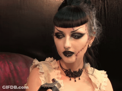 Woman With Stitches Holding Device Saying SD Card GIF