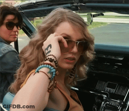 Woman With Sunglasses And Ecl Tattoo On Wrist GIF
