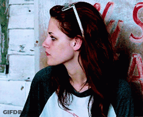 Woman With Sunglasses And Headband Leaning Against Wall With Letter S GIF