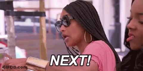 Woman With Sunglasses And Pink Shirt Beside Another Saying Next GIF