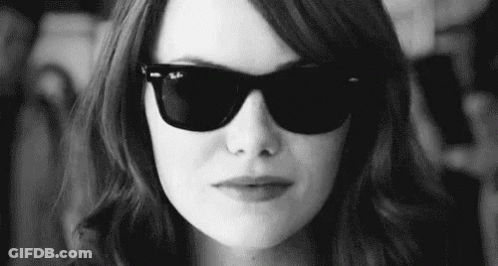 Woman With Sunglasses Making Funny Face Black And White GIF
