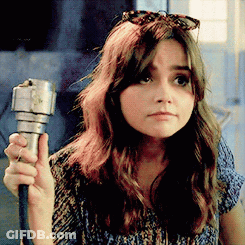 Woman With Sunglasses On Head Holding Flashlight GIF