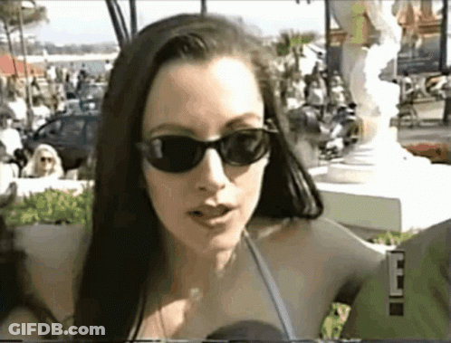 Woman With Sunglasses Talking Into Microphone 'E GIF