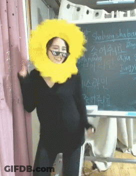 Woman With Sunglasses, Yellow Hat, And Shabang Blackboard GIF