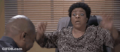 Woman With Surprised Look Sitting GIF