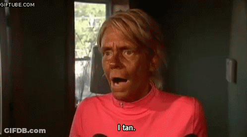 Woman With Tan On Face And Pink Shirt GIF