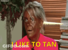 Woman With Tan Saying I Like To Tan GIF