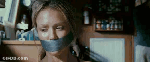 Woman With Tape On Mouth Talking On Phone GIF