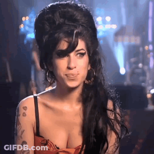 Woman With Tattoo In Red Dress Big Hairdo GIF