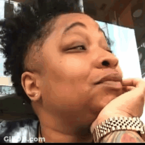 Woman With Tattoo Making Funny Face GIF