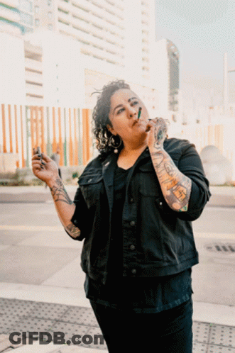 Woman With Tattoos Smoking GIF