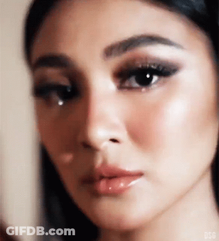 Woman With Tear On Cheek GIF