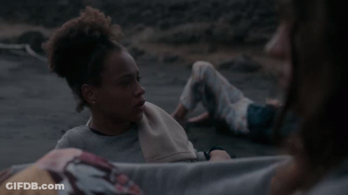 Woman With Towel Looking At Another Woman GIF