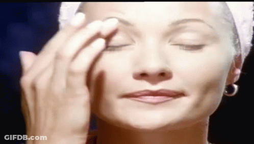 Woman With Towel On Head Applying Makeup GIF