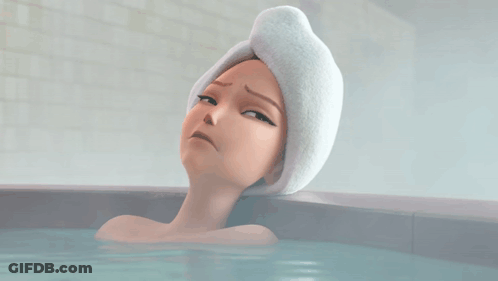 Woman With Towel On Head Laying In Bathtub GIF