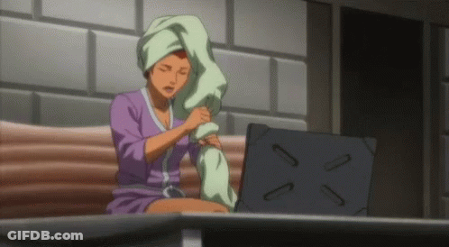 Woman With Towel On Head Sits At Laptop GIF