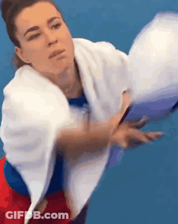 Woman With Towel Throwing Tennis Ball GIF