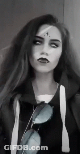 Woman With Vampire Makeup And Sunglasses GIF
