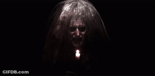 Woman With Veil Holding Candle GIF