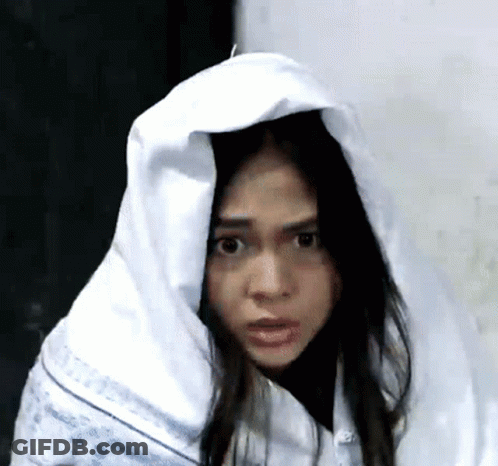 Woman With White Blanket On Head Making Funny Face GIF