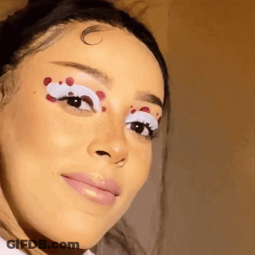 Woman With White Eyelashes And Red Spots GIF