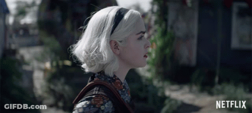 Woman With White Hair And Netflix Logo GIF