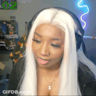 Woman With White Hair Wearing Headphones And Necklace GIF