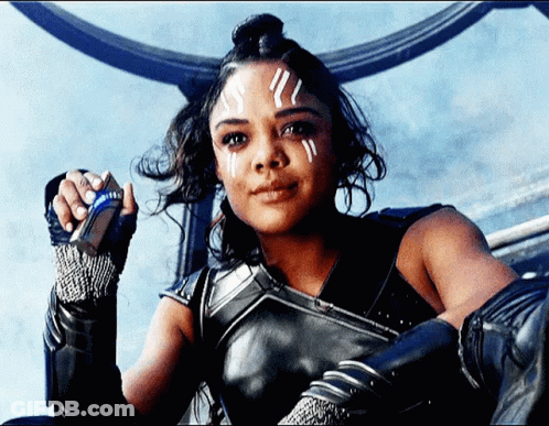 Woman With White Paint On Face Sitting On Throne GIF