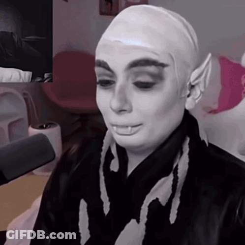Woman With Wig And Scarf Saying I GIF