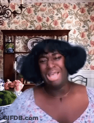 Woman With Wig Making Funny Face GIF