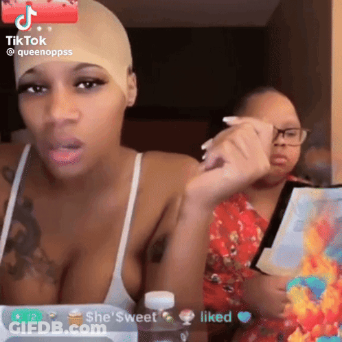 Woman With Wig Talking To Another Woman GIF