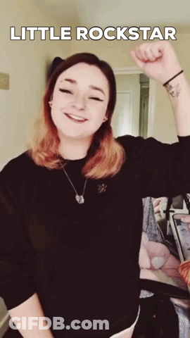 Woman With Wrist Tattoo Fist Up Little Rockstar GIF