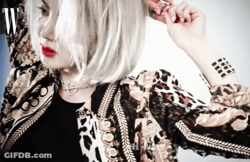 Woman With Wrist Tattoo Wearing Jacket GIF
