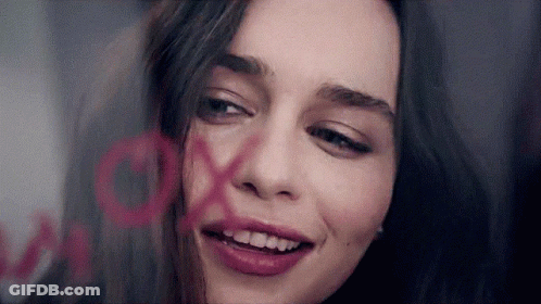 Woman With XOXO Painted On Face GIF