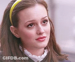 Woman With Yellow Headband Looking To Side GIF