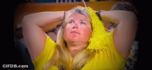 Woman With Yellow Pom Poms Watching Game GIF