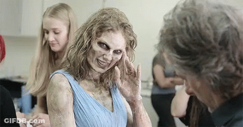 Woman With Zombie Makeup Talking To Man GIF