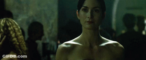 Woman Without Shirt Looking At Camera GIF