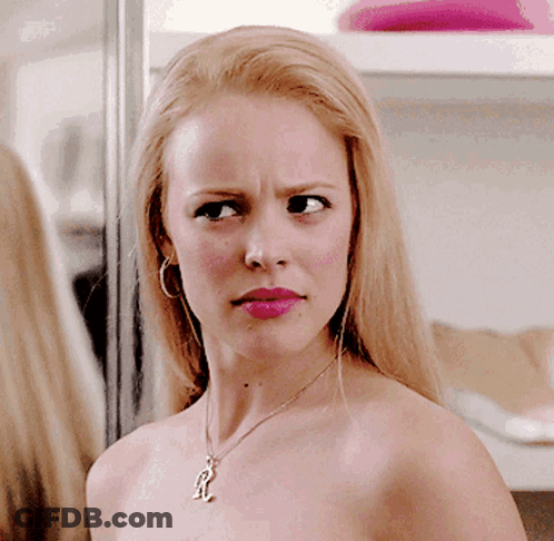 Woman Without Shirt Wearing Necklace With R GIF
