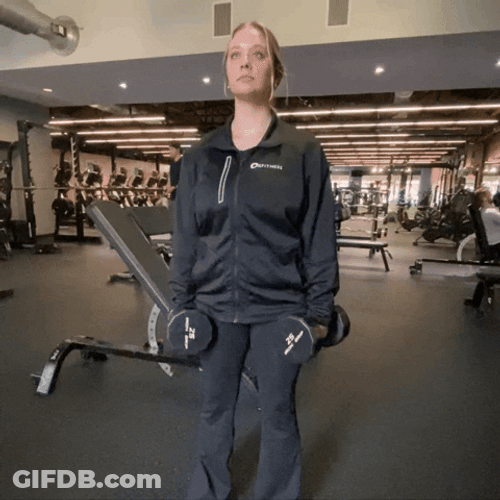 Woman Working Out Looks Like She Shrugs GIF