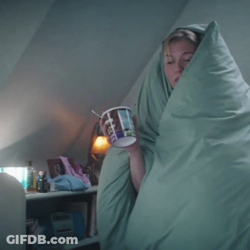 Woman Wrapped In Blanket Holding Coffee GIF