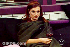 Woman Wrapped In Blanket Holding Wine Glass GIF