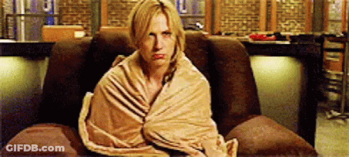 Woman Wrapped In Blanket In Chair GIF
