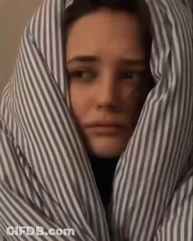 Woman Wrapped In Striped Blanket GIF