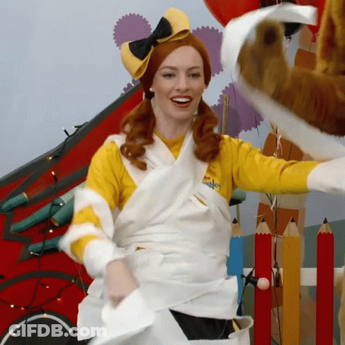 Woman Wrapped In Toilet Paper Wearing Yellow Shirt Saying Wiggle GIF