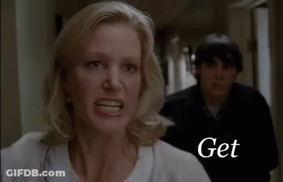 Woman Yelling At Man In Hallway GIF