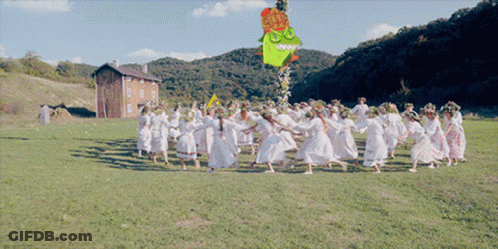 Women Dancing In Field With Cartoon Hanging GIF